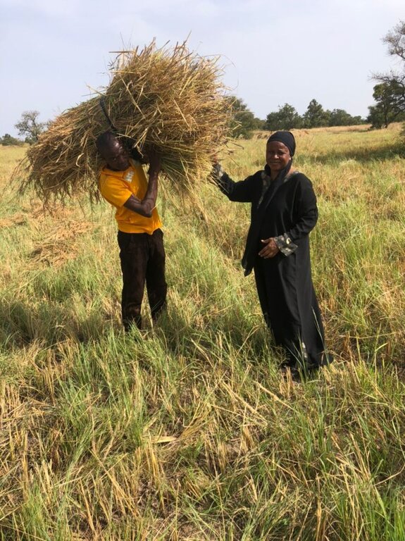 One of our project coordinators with a local farmer